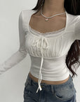 Lace Edge Stitching Fake Two-piece Long-sleeved T-shirt Slim Pleated Lace-up Short Top